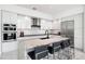 Modern kitchen featuring stainless steel appliances and expansive island at 1155 N Gulfstream Ave # 208, Sarasota, FL 34236