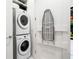 Convenient laundry room with washer, dryer and ironing board at 1155 N Gulfstream Ave # 208, Sarasota, FL 34236