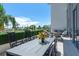 Spacious patio with dining area and water views at 1155 N Gulfstream Ave # 208, Sarasota, FL 34236