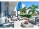 Spacious furnished patio with city views and lush landscaping at 1155 N Gulfstream Ave # 208, Sarasota, FL 34236