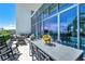 Enjoy this expansive patio with multiple seating areas and city views at 1155 N Gulfstream Ave # 208, Sarasota, FL 34236