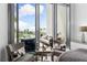 Cozy sitting area with patio doors leading to balcony at 1155 N Gulfstream Ave # 208, Sarasota, FL 34236