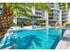 Inviting resort-style pool with plenty of lounge chairs at 1155 N Gulfstream Ave # 208, Sarasota, FL 34236