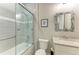 Bathroom with a shower/tub combo and gray tile at 17006 Hampton Falls Ter, Lakewood Ranch, FL 34202