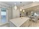 Island kitchen with stainless steel appliances and white cabinetry at 17006 Hampton Falls Ter, Lakewood Ranch, FL 34202