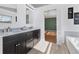 Main bathroom with double vanity and large soaking tub at 3125 57Th Avenue E Cir, Bradenton, FL 34203