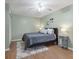 Spacious bedroom with wood floors and ceiling fan at 3125 57Th Avenue E Cir, Bradenton, FL 34203