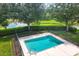 Relaxing community pool with surrounding landscaping and fence at 3125 57Th Avenue E Cir, Bradenton, FL 34203