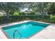 Refreshing community pool with steps and surrounding landscaping at 3125 57Th Avenue E Cir, Bradenton, FL 34203