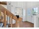 Bright entryway with wood stairs and view of an office at 3125 57Th Avenue E Cir, Bradenton, FL 34203