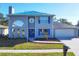 Two-story house with gray siding, blue shutters, and a two-car garage at 3125 57Th Avenue E Cir, Bradenton, FL 34203