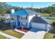 Two-story house with gray siding, blue shutters, and new roof at 3125 57Th Avenue E Cir, Bradenton, FL 34203