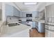 Kitchen with light blue cabinets and quartz countertops at 3125 57Th Avenue E Cir, Bradenton, FL 34203