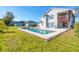 Swimming pool and spa surrounded by grass at 3125 57Th Avenue E Cir, Bradenton, FL 34203