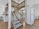 Wooden staircase with carpet runner, leading to upper level at 3125 57Th Avenue E Cir, Bradenton, FL 34203