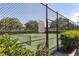 Tennis court with chain link fence and signage at 3125 57Th Avenue E Cir, Bradenton, FL 34203