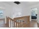 Upstairs hallway with wood floors and access to bedrooms at 3125 57Th Avenue E Cir, Bradenton, FL 34203