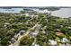 Aerial view showcasing the home's location in a lush, waterfront community at 3464 Camino Real, Sarasota, FL 34239