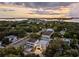 Elevated view of a modern home in a residential neighborhood near the water at 3464 Camino Real, Sarasota, FL 34239