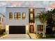 Modern two-story home with a sleek design and attached garage at 3464 Camino Real, Sarasota, FL 34239