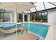 Inviting pool and spa area with lounge chairs at 3464 Camino Real, Sarasota, FL 34239