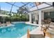 Expansive pool and spa with outdoor kitchen at 3464 Camino Real, Sarasota, FL 34239