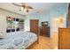 Bedroom with wood flooring, king bed, and built-in wardrobe at 4532 Shark Dr, Bradenton, FL 34208