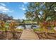 Private dock and access to a serene canal with lush landscaping at 4532 Shark Dr, Bradenton, FL 34208