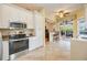 Bright kitchen, stainless steel appliances, view into Gathering room at 4532 Shark Dr, Bradenton, FL 34208