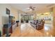 Spacious living room with hardwood floors, sliding doors to patio and pool at 4532 Shark Dr, Bradenton, FL 34208