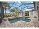 Relaxing screened pool and spa with patio area at 4532 Shark Dr, Bradenton, FL 34208