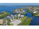 Aerial view of waterfront property with boat and homes at 4607 5Th Ne Ave, Bradenton, FL 34208