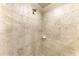 Shower with tile surround, shower head, soap dish, and neutral color scheme at 6708 Grand Estuary Trl # 104, Bradenton, FL 34212