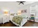 Bright bedroom with white bed frame and wood floors at 5308 Morey Farms Loop, Palmetto, FL 34221