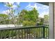 Private balcony overlooking lush tropical landscape at 1520 Pelican Point Dr # 251, Sarasota, FL 34231
