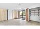 Bedroom with private balcony access and tile floors at 1520 Pelican Point Dr # 251, Sarasota, FL 34231