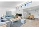 Living room with open floor plan, staged furniture at 1520 Pelican Point Dr # 251, Sarasota, FL 34231
