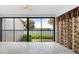 Bright living room with water views and sliding glass doors at 1520 Pelican Point Dr # 251, Sarasota, FL 34231