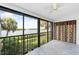 Bright sunroom with water views and tile floor at 1520 Pelican Point Dr # 251, Sarasota, FL 34231