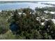 Large waterfront lot with mature landscaping at 7401-B Midnight Pass Rd, Sarasota, FL 34242
