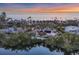 Aerial sunset view of waterfront property at 7665 Sanderling Rd, Sarasota, FL 34242