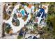 Aerial view of home, pool, and tropical landscaping at 7665 Sanderling Rd, Sarasota, FL 34242