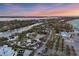 Aerial view of luxury homes and waterfront property at sunset at 7665 Sanderling Rd, Sarasota, FL 34242