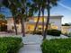 Outdoor patio with string lights, table, and lush landscaping at 7665 Sanderling Rd, Sarasota, FL 34242