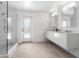 Spa-like bathroom with double vanity, large shower, and modern fixtures at 7665 Sanderling Rd, Sarasota, FL 34242