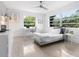 Bedroom with twin bed, built-in desk, and window at 7665 Sanderling Rd, Sarasota, FL 34242