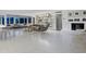 Spacious living area with fireplace and terrazzo flooring at 7665 Sanderling Rd, Sarasota, FL 34242