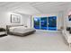 Spacious main bedroom with sliding glass doors to patio at 7665 Sanderling Rd, Sarasota, FL 34242