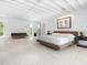 Bright and airy main bedroom with large windows and hardwood floors at 7665 Sanderling Rd, Sarasota, FL 34242