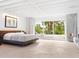 Spacious main bedroom with water views and private deck access at 7665 Sanderling Rd, Sarasota, FL 34242